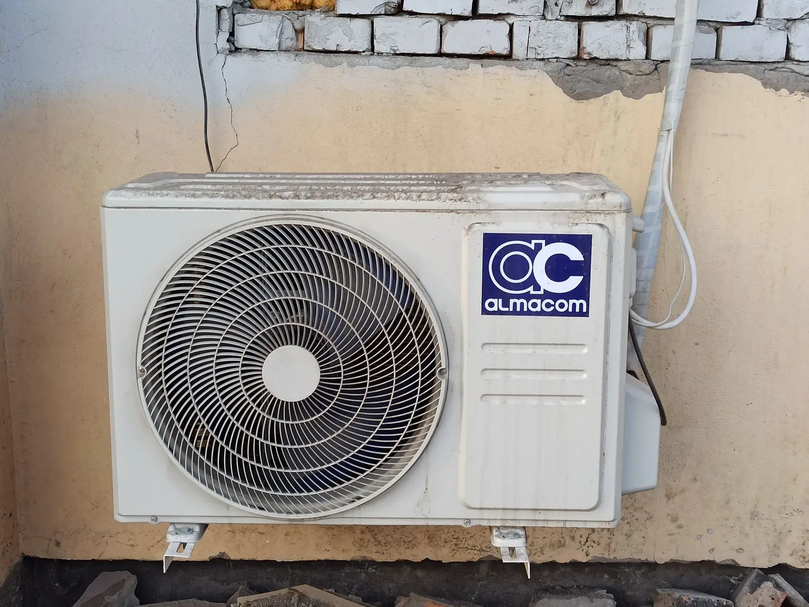Mini-split outdoor condenser mounted on a wall